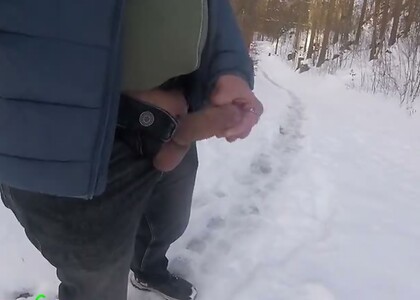 I hike through a dreamy, snowy forest in winter and masturbate my cock with a ring around it.
